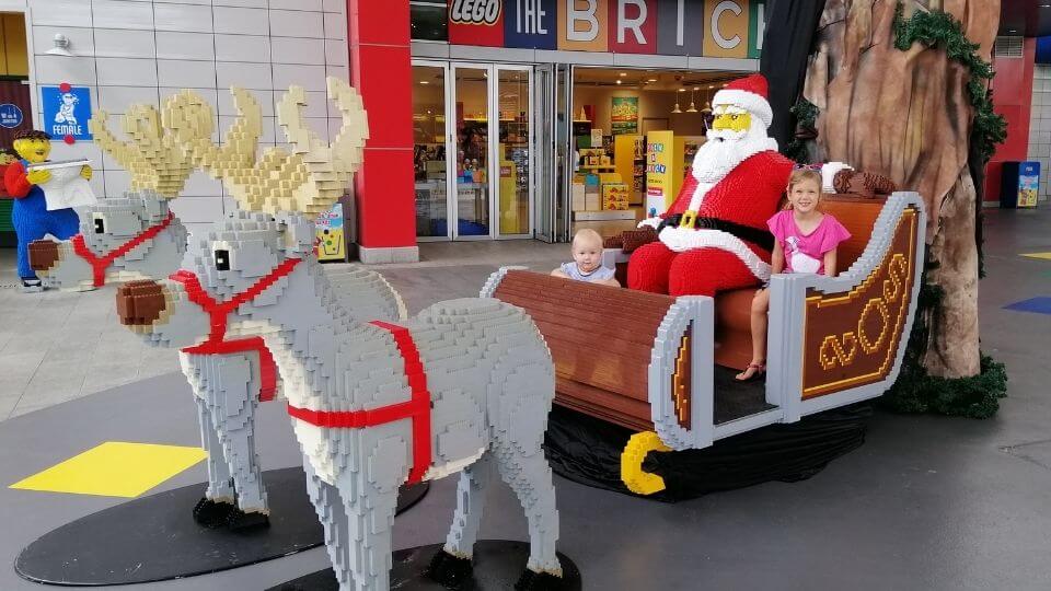 Legoland Malaysia theme park Christmas - Ayla and Romy on Santa's sleigh