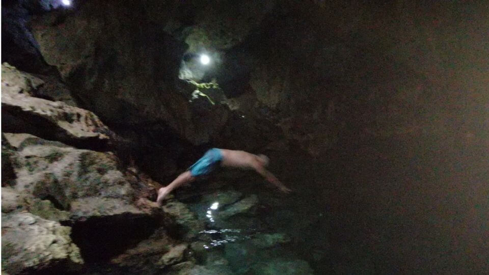Things to do in Bohol with kids-Hinagdanan Cave, Panglao Island-Colin diving into the water