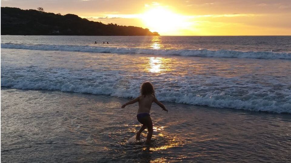 Things to do in Bali with kids-Jimbaran Bay sunset-Ayla in ocean