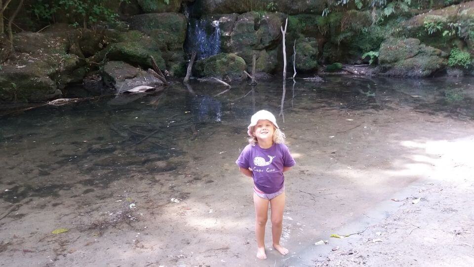 Things to do in Gisborne-Waihirere Domain waterfall walk-Ayla in the water