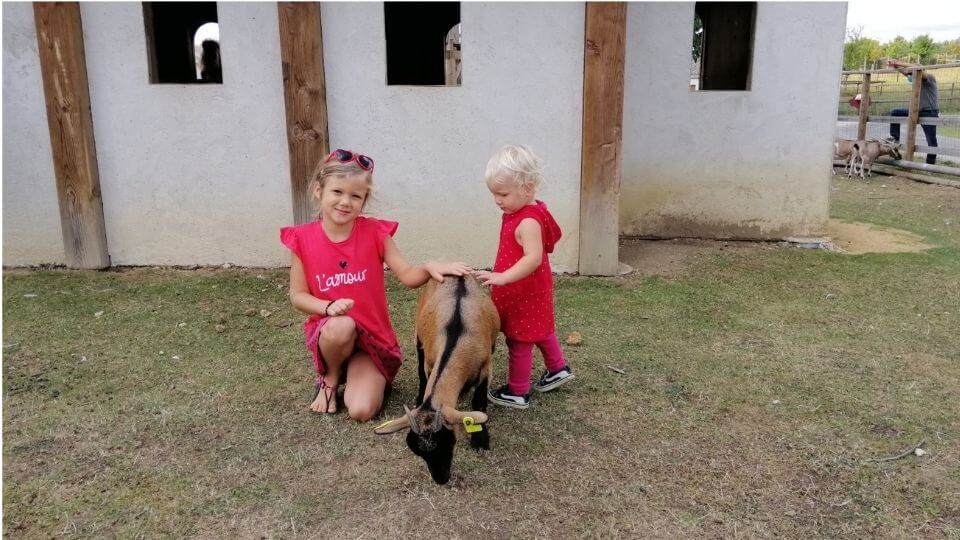 Things to do in Poitou Charentes France-DefiPlanet-Ayla and Romy with goat