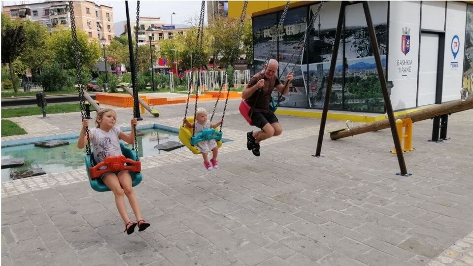 Things to do with kids in Tirana-outdoor playgrounds-Alay, Romy, Colin on swings