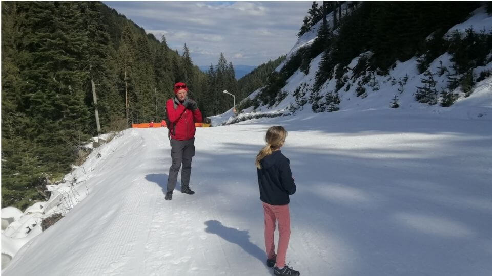 Things to do in Bansko Bulgaria-hike up the ski road-Colin and Ayla