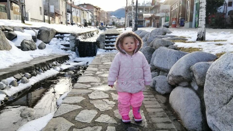 Things to do in Bansko Bulgaria in the winter time-Romy in a snowy street