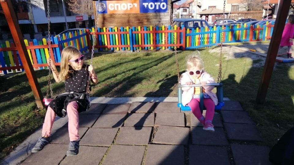 Things to do with kids in Bansko-outdoor playgrounds-Ayla and Romy on swings