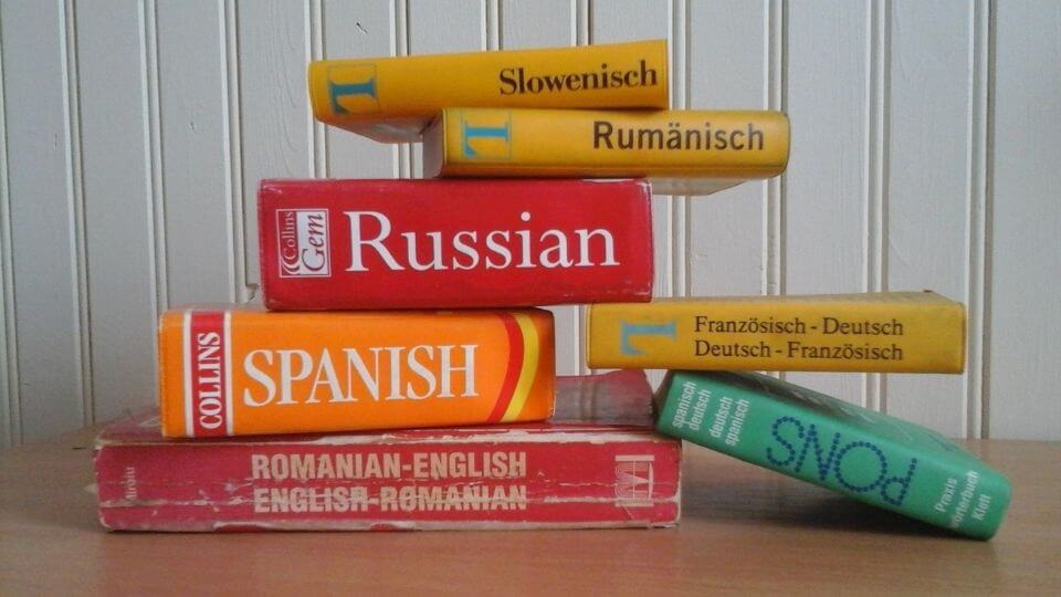 Benefits of learning a new language-piles of language books