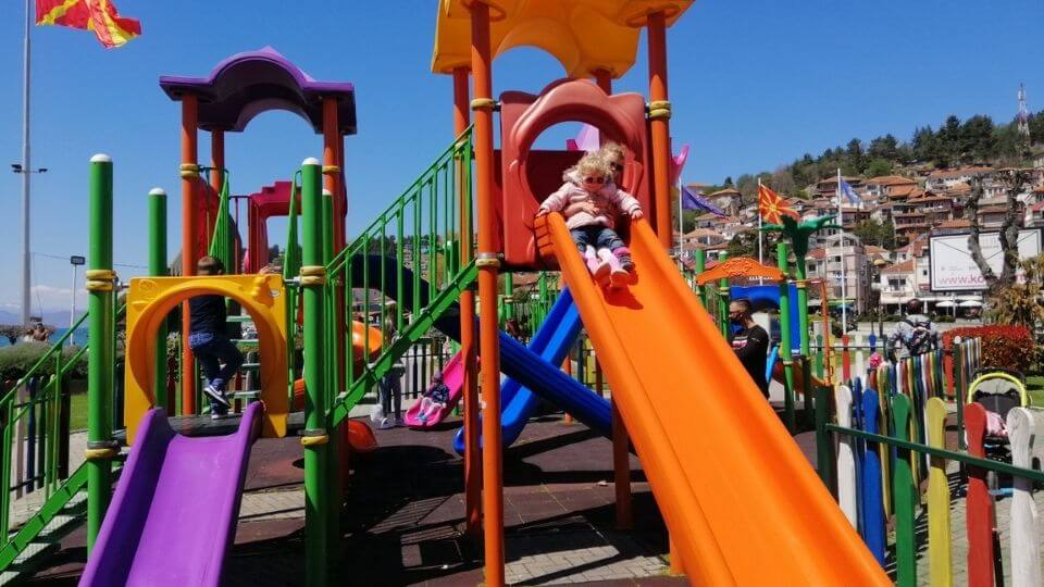 Things to do in Ohrid-Ohrid City Park and Spielplatx playground-Ayla and Romy at top of slide