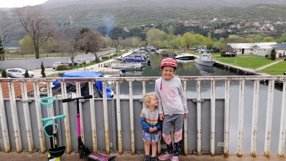 Things to do in Ohrid town-bridge before the skate park-lakefront Promenade-Romy and Ayla with scooters