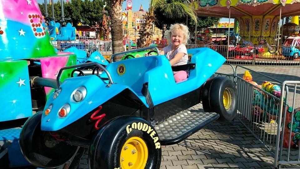 Aktur Park in Konyaalti for things to do in Antalya with kids-Romy on a little kids ride