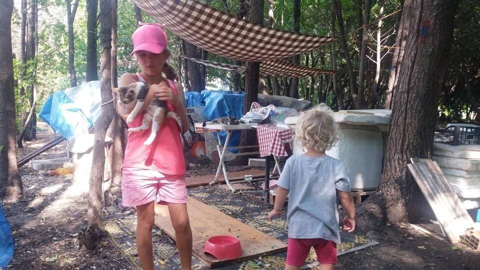 Ayla and Romy playing with cats at the cat pod in Calis, located behind SAF