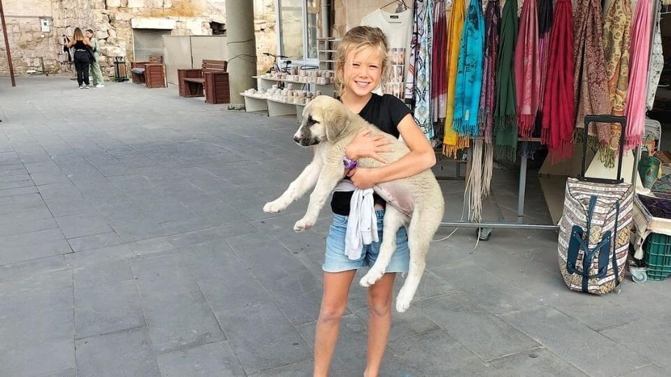 Ayla holding a cute puppy after visiting the Kaymakli underground city