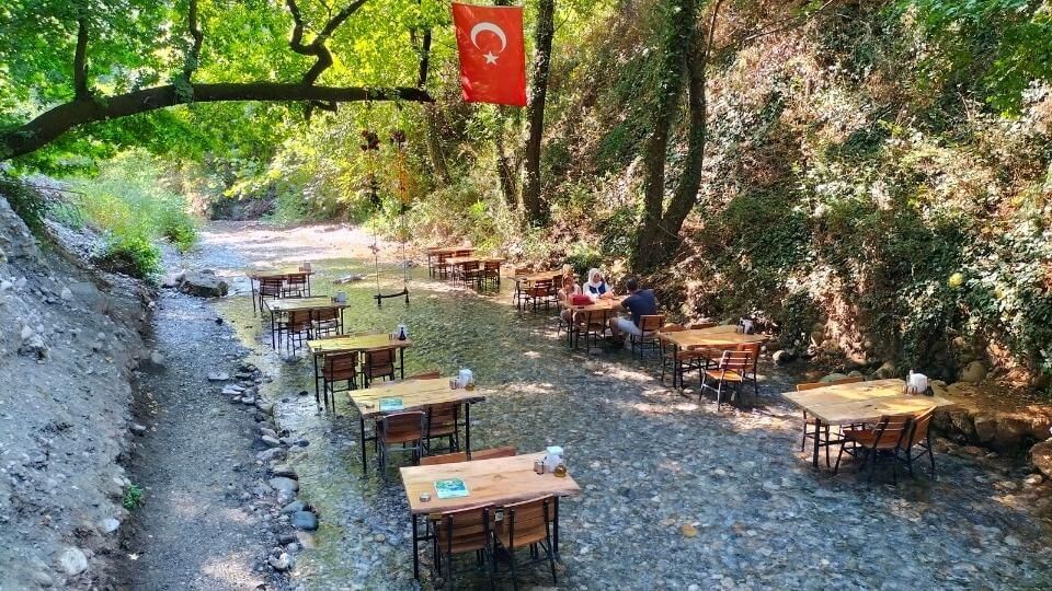 Dine at a waterfall restaurant and dip your feet in the cool clear water for things to do in Dalyan and nearby
