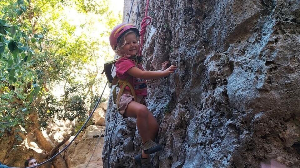 Romy harnessed up and rock climbing age 3 in Geyikbayiri, Antalya, Turkey