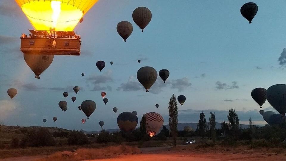 Things to do in Cappadocia-get up early to watch the hot air balloons taking off-a balloon fires up and several in the sky
