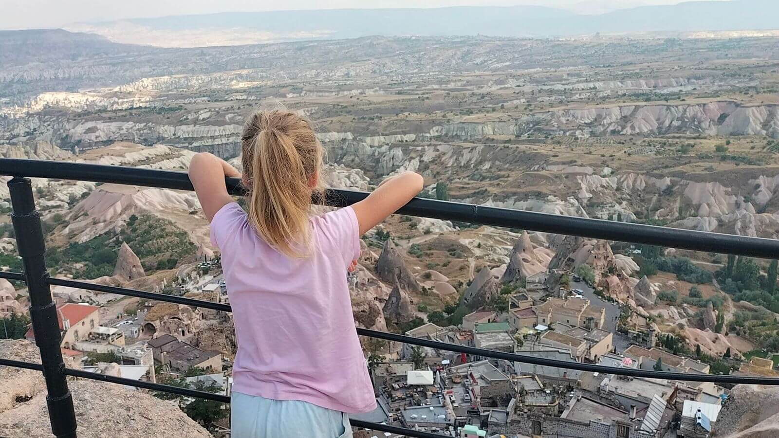 Things to do in Cappadocia-walk up Uchisar castle-Ayla at the top of the castle with a view across the surrounding landscape