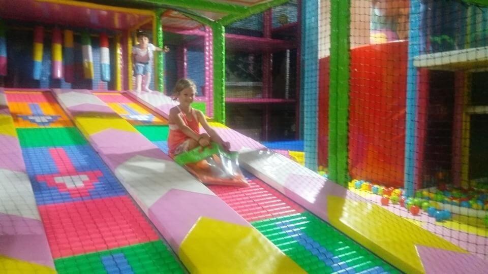Things to do in Fethiye with kids-Erasta play park-Ayla riding down the slide