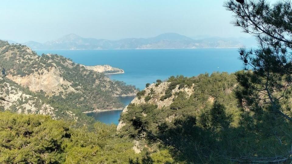 View of the blue water from the hill on the Fethiye to Kayakoy hike