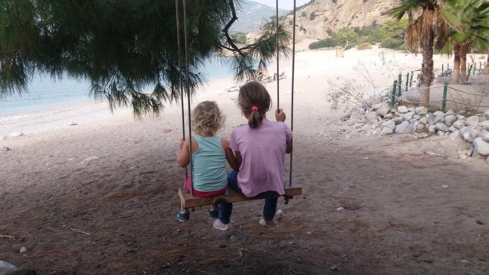 things to do in fethiye-chill out at Kidrak beach-Ayla and Romy on swing