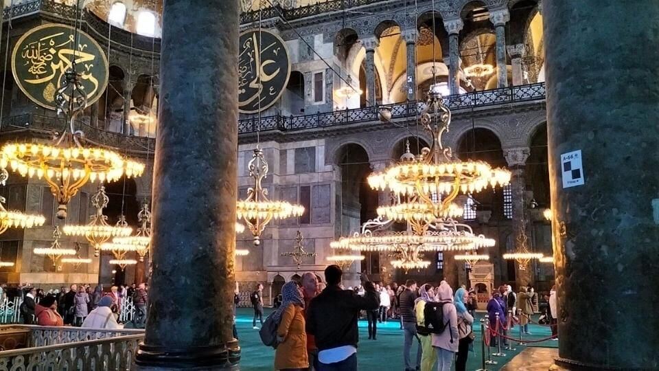 A view of many people inside the Hagia Sofia in Istanbul