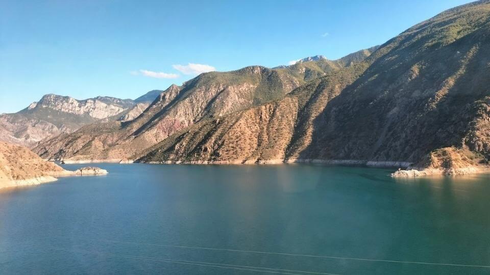A view of water and hills out the bus window between Kars and Sarpi