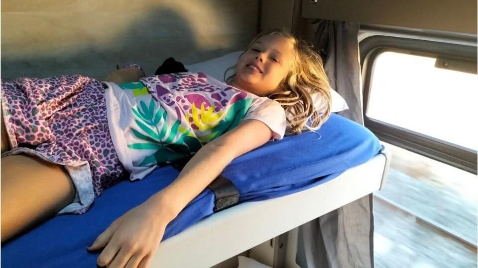 Ayla lying on her bed in our cuchette on the Dogu express train from Ankara to Kars in Turkey