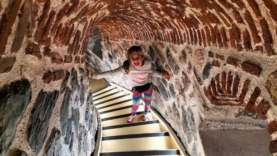 Ayla walking down the spiral staircase at the Galata tower in Istanbul