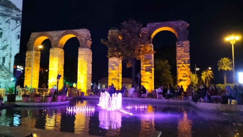 Lights on the fountains and ancient-looking pillars in the Selcuk town center
