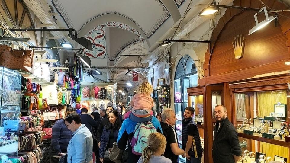 Romy riding on Colin's shoulders inside the Grand Bazaar in Istanbul
