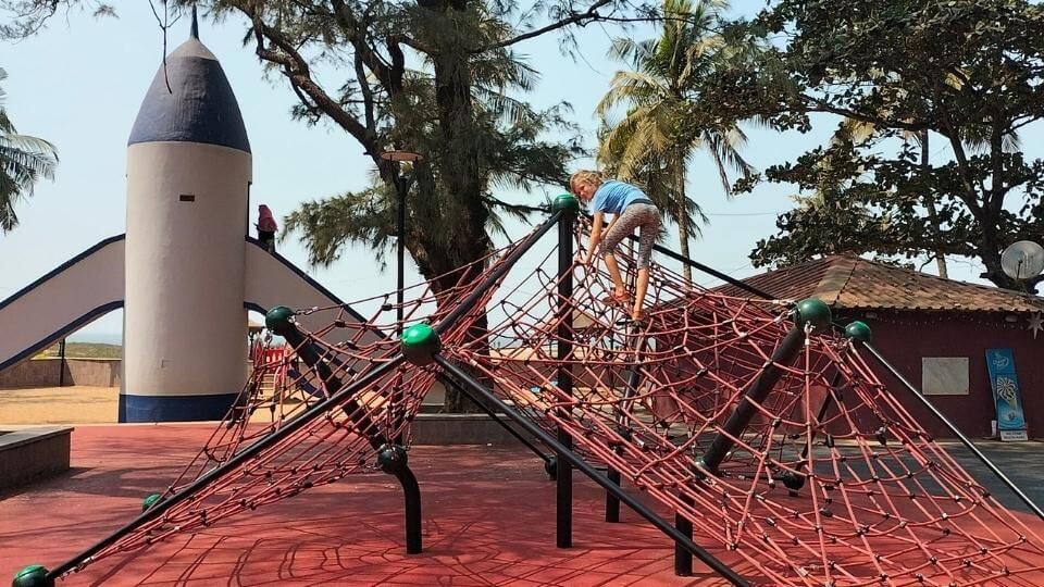 Ayla on the climbing frame at the Miramar beach playground in Panjim city, North Goa.