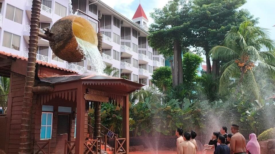 The Lotus Desaru Resort has a waterpark with a huge coconut that pours out water onto the people below.