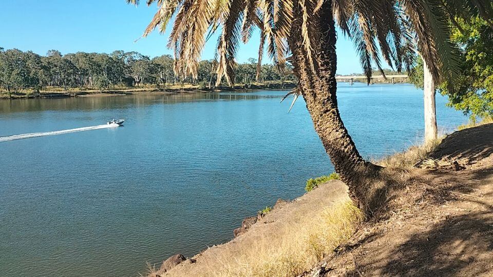 A view of a boat on the Burnett River in Bundaberg, a lovely nature spot near town.