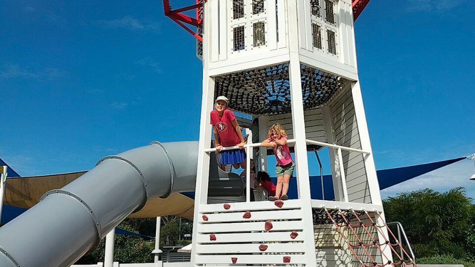 Ayla and Romy in the lighthouse slide at Jingeri Park Redlands.