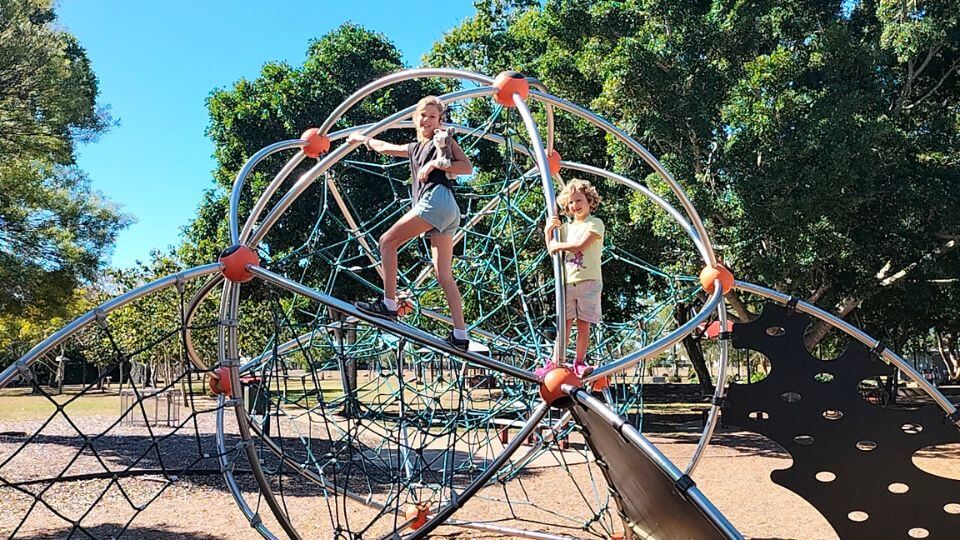 Ayla and Romy on a climbing frame at Boreham Park in Bundaberg.