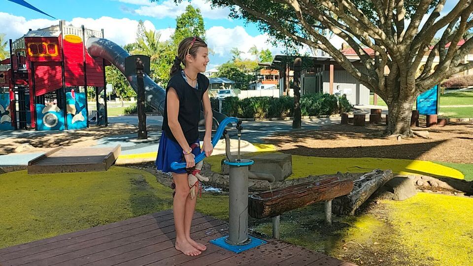 Ayla at the water pump at Beth Boyd Park on Brisbane's Bayside.