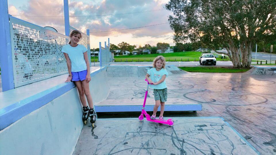 Ayla on rollerblades and Romy with her scooter at the Redland Bay Skate Park at sunset.
