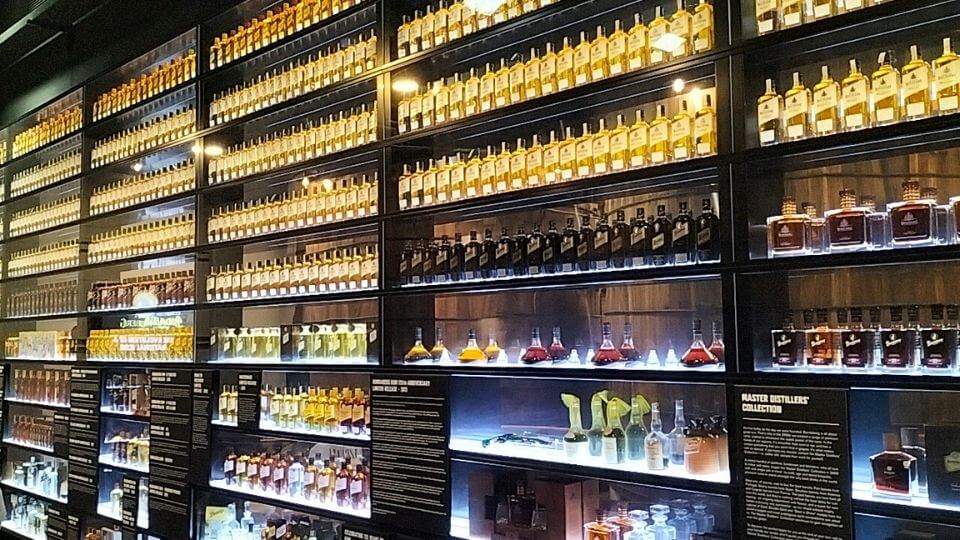 Bottles line the shelves at the Bundaberg Rum Distillery museum experience.