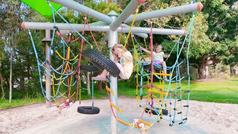 Romy and Ayla on the play equipment at Potts Place Park Playground in Redland Bay.