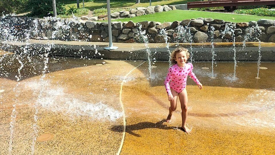 Romy runs through the water at the Rockpools, the only splash park on the Gold Coast.
