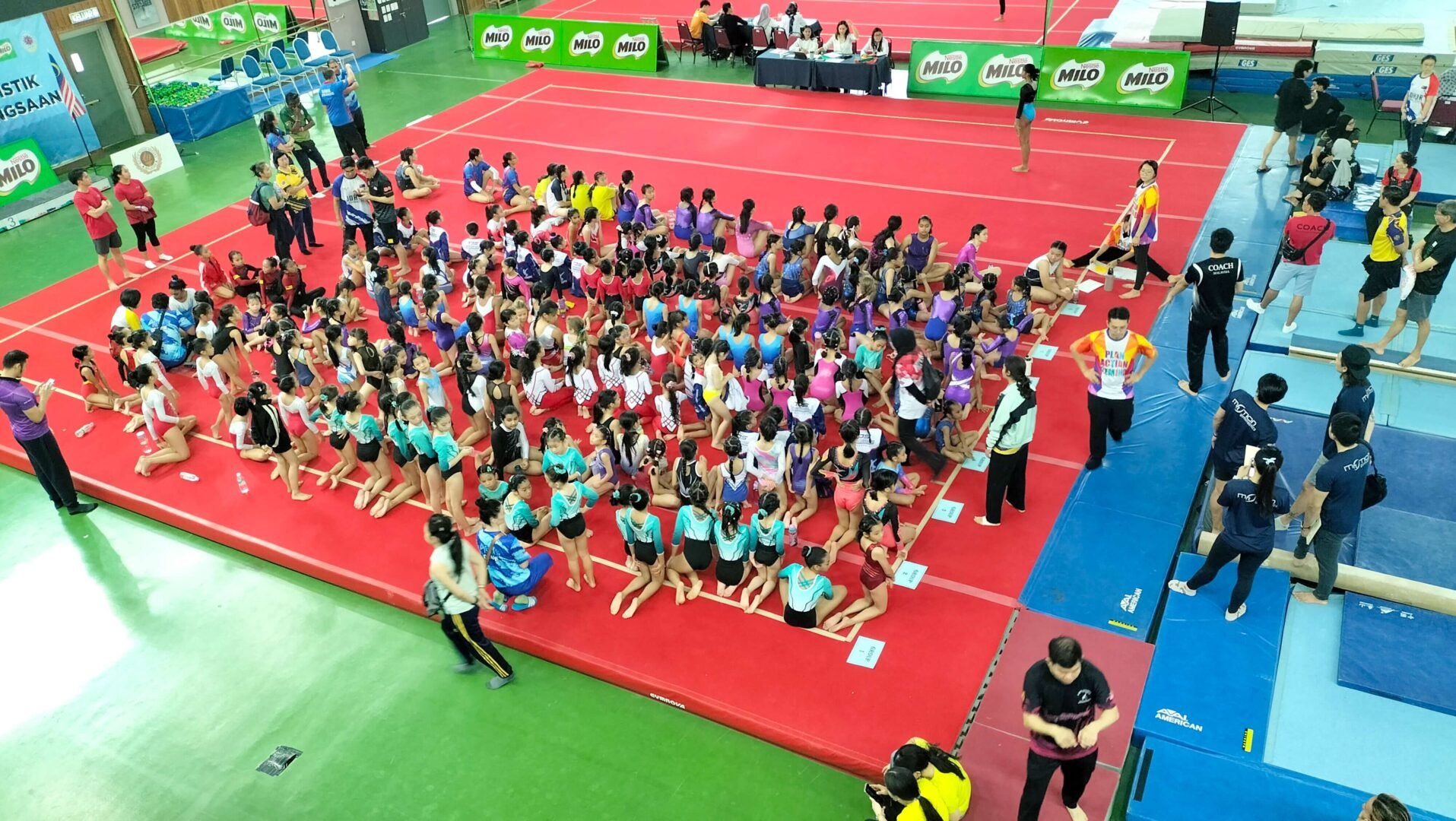An overhead view of the gymnasts at the Sirkit Remaja competition in Kuala Lumpur, Malaysia, 2024.