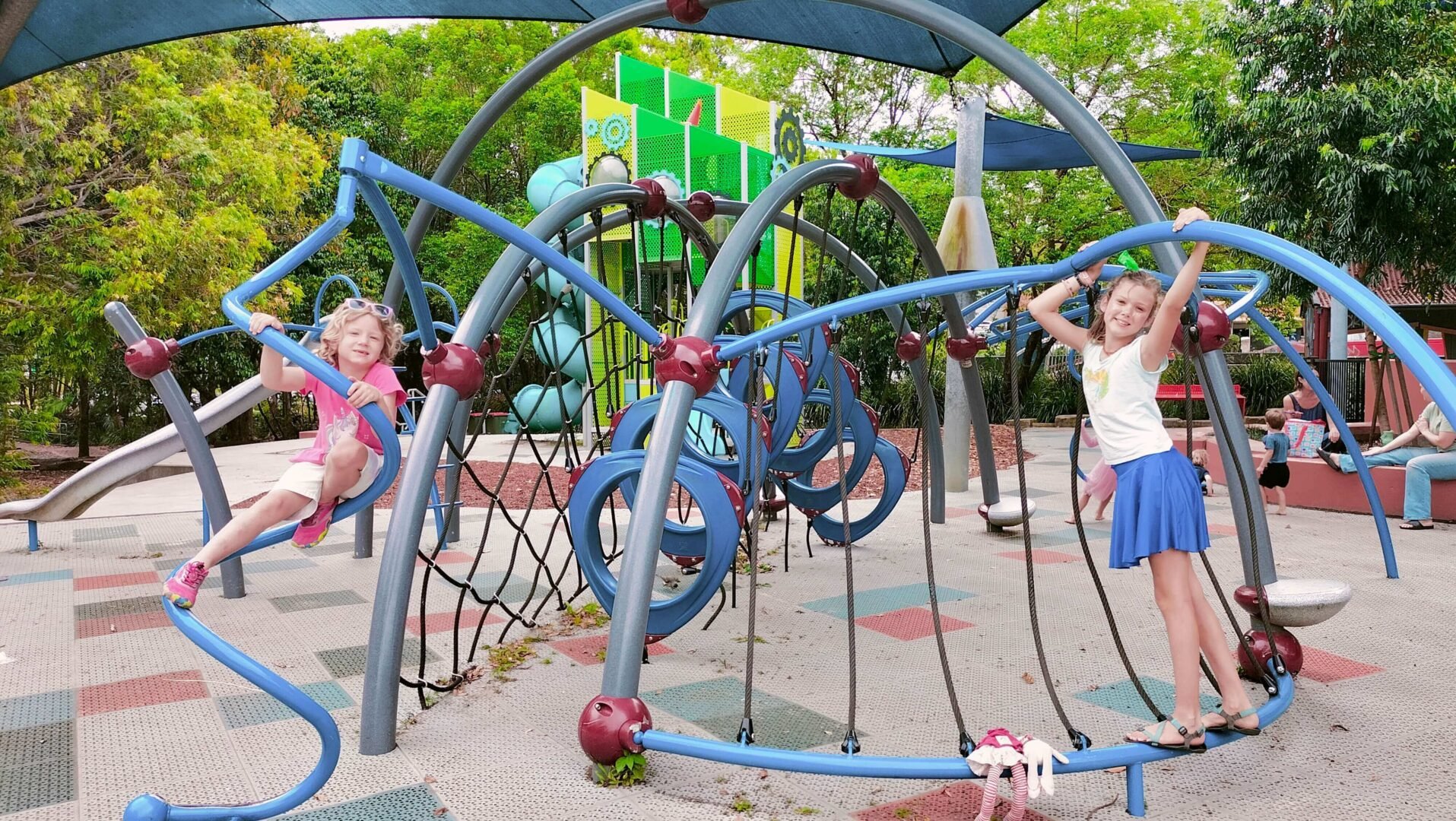 Ayla and Romy playing in the playground at Quota Memorial Park in Nambour.