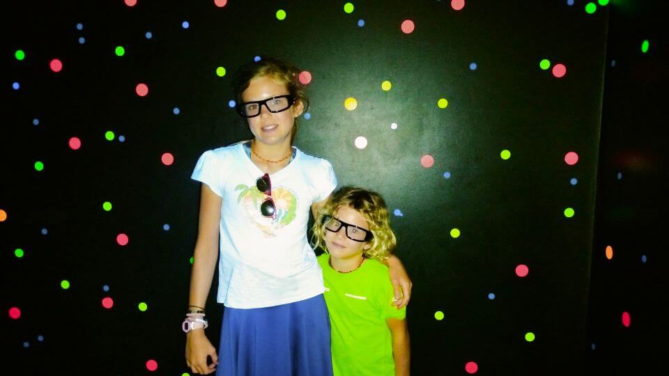 Ayla and Romy wearing special glasses in the Illusionarium at Aussie World theme park.