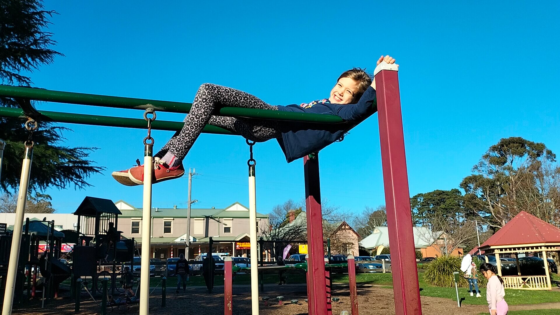 Ayla hanging around on the playground bars in Emerald, Dandenong Ranges, Victoria, Australia.