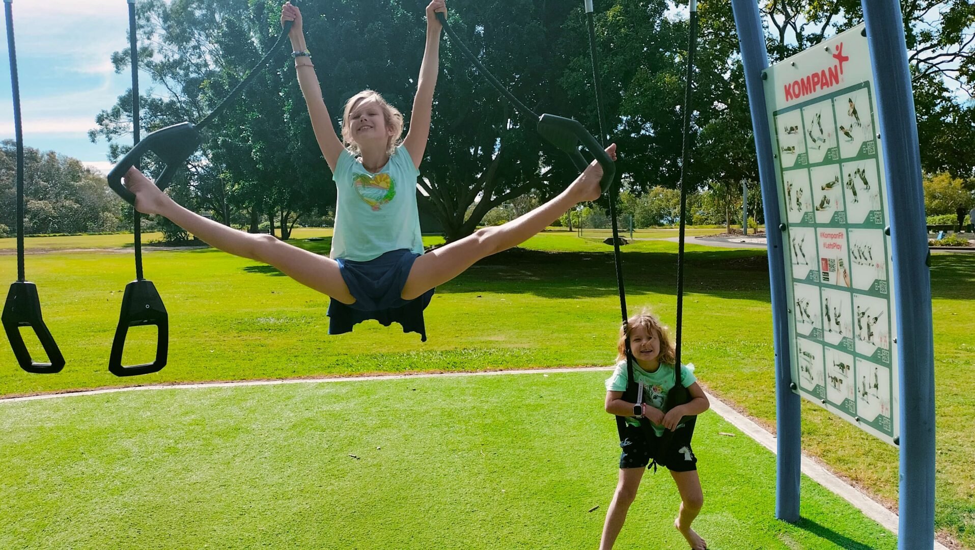 Ayla showing off her flexibility, and her sister Romy, at Les Moore Park in Brisbane.