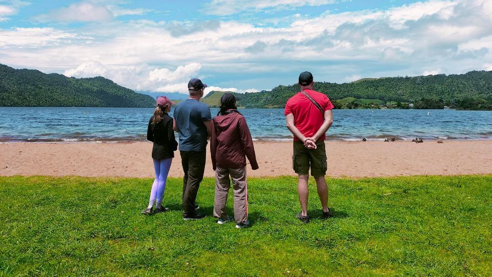 Colin, Ayla and friends look out across Lake Okareka near Rotorua on a sunny day.