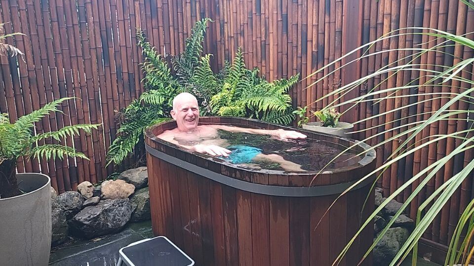 Colin braves the cold plunge bath at the Secret Spot Hot Tubs.
