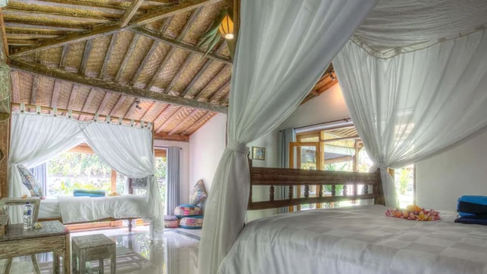 A spacious room at Pelan Pelan Bali Surf and Yoga retreat.