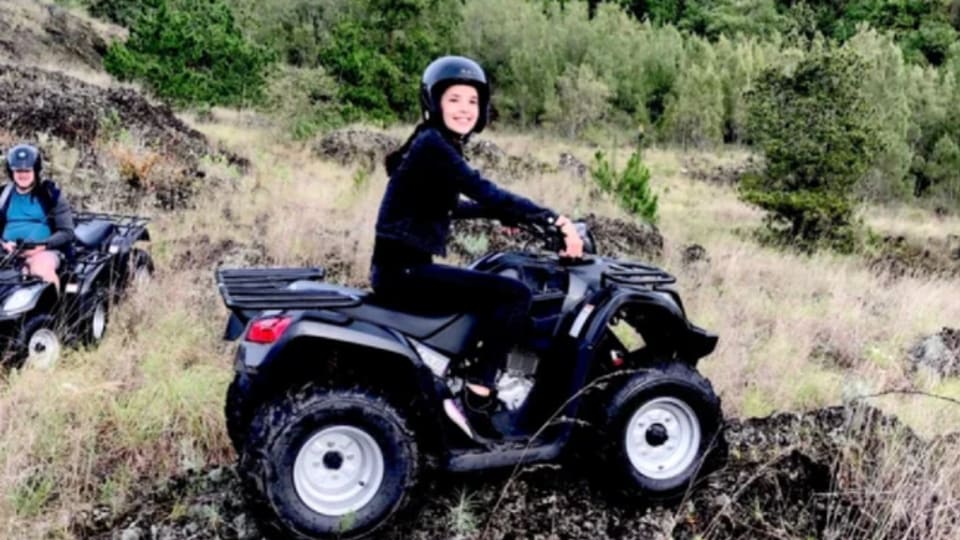 A young person drives a quad bike during a three-day active family holiday in Bali's North with Stoked Surf Bali.