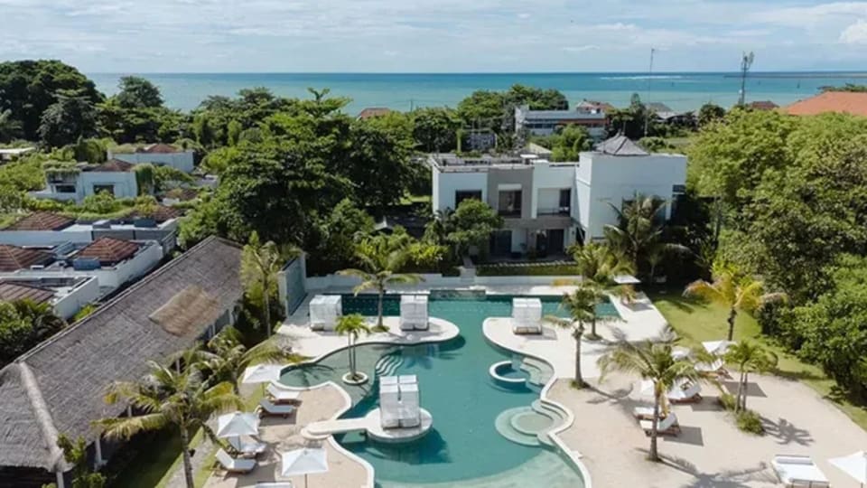An overhead view of Pronoia Resort, a gorgeous spot for family retreats on Jimbaran Bay in Bali, Indonesia.