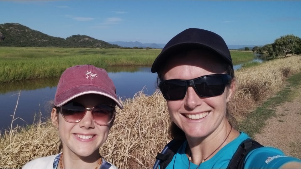 Ayla and Elly smile for a selfie during a walk at Freshwater Lagoon in the Town Common Conservation Park in Townsville on a bright, sunny day.