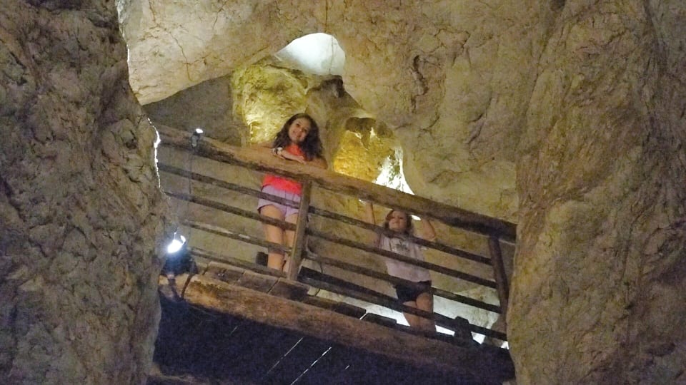 Ayla and Romy on a walkway on the Cathedral Cave Tour at the Capricorn Caves near Rockhampton.